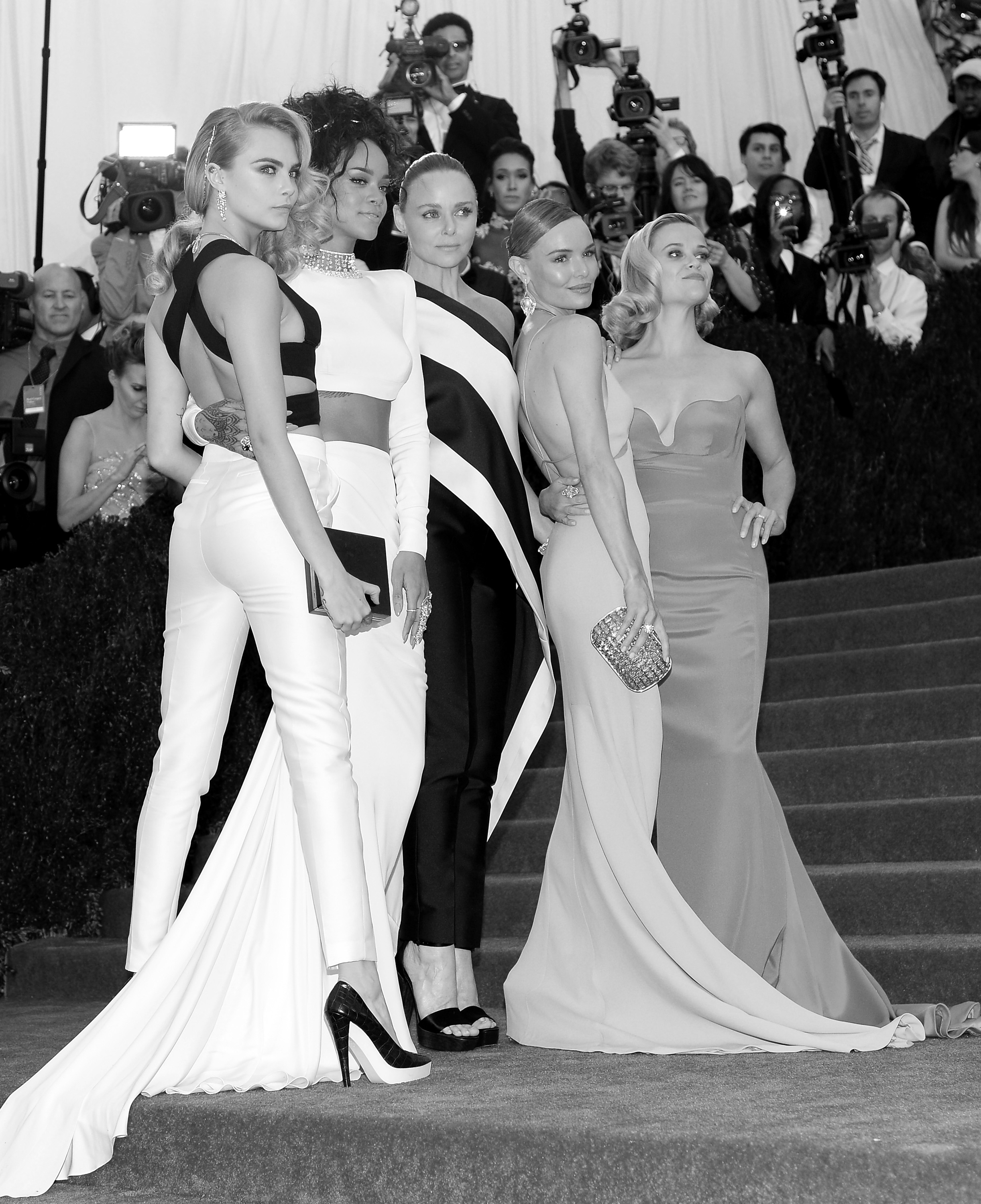 NEW YORK, NY - MAY 05: (EDITORS NOTE: Image was converted to black and white) (L-R) Cara Delevigne, Rihanna, Stella McCartney, Kate Bosworth and Reese Witherspoon attend the "Charles James: Beyond Fashion" Costume Institute Gala at the Metropolitan Museum of Art on May 5, 2014 in New York City. (Photo by Dimitrios Kambouris/Getty Images)